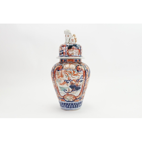 411 - A Japanese Imari Vase decorated in Blue & Rust depicting Cartouches of flowers with a fitted lid & a... 