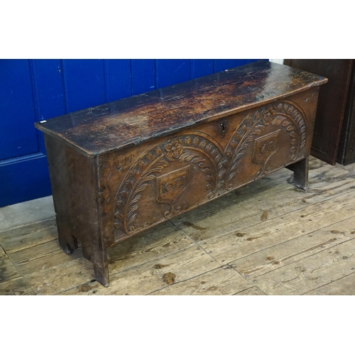 475 - An Antique Oak Single Panelled Coffer resting on a 