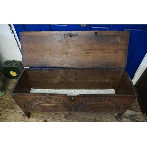 475 - An Antique Oak Single Panelled Coffer resting on a 