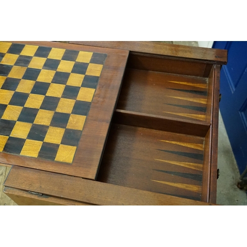 478 - A Reproduction Mahogany Sliding Top Tow Drawers Games Table with a Chess Top & Backgammon resting on... 