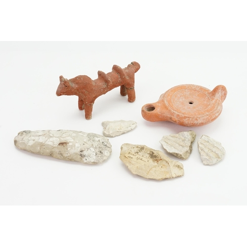 563 - A Roman design Oil Lamp in Terracotta along with three various Knapped items & a study of an Ox.