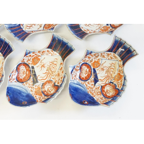 402 - Six Japanese Imari pattern Fish Shaped Dishes decorated in Rust, Blue & Cream, signed.