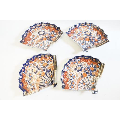 405 - A Set of Four Japanese Imari pattern Fan Shaped Dishes decorated in Rust, Blue & Cream, signed. (One... 