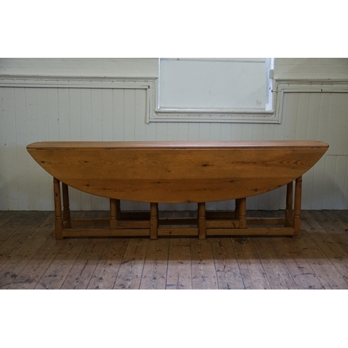 471 - An 18th Century design Irish Pine Wake Table with Fold-Out Bulbous Flaps & Square Cross Stretchers i... 