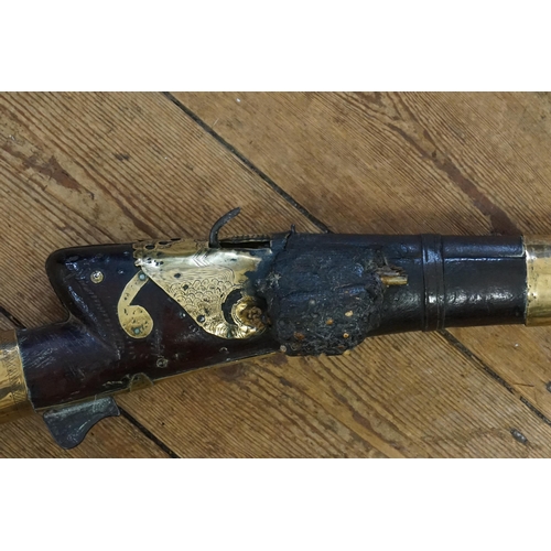 269 - An antique Turkish bore brass mounted miquelet lock gun. Late 19th century