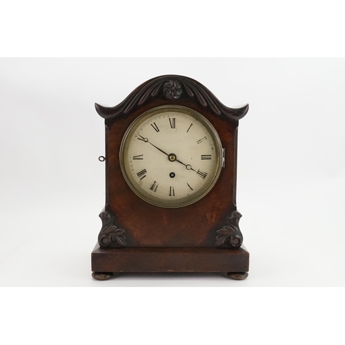 205 - An Early Victorian Walnut Bracket Clock with a dome top, shaped sides, Brass movement & a painted fa... 