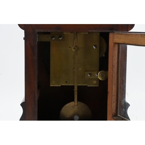 205 - An Early Victorian Walnut Bracket Clock with a dome top, shaped sides, Brass movement & a painted fa... 