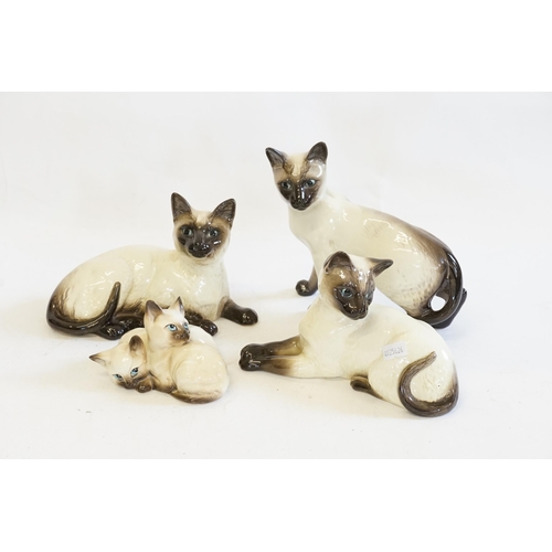 310 - A Collection of Beswick Siamese Cats to include, 1558, 1296, 1559 and one other. Along with various ... 