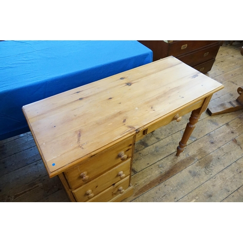 517 - A Pine Three Drawers Dressing Table/Desk. Measuring: 102cms across x 43cms deep x 75cms high.