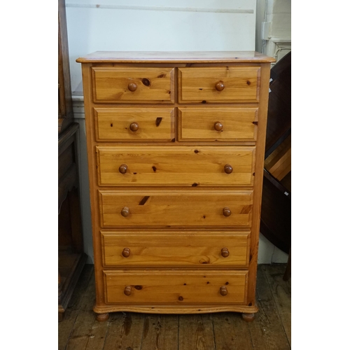 521 - A Large Eight Drawers Pine Chest of Drawers. Measuring: 80cms across x 47cms deep x 125cms high.