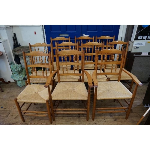 513 - A Set of 8 + 2 Pine & Wicker Seated Kitchen Chairs to include Two Carvers & Eight Chairs.