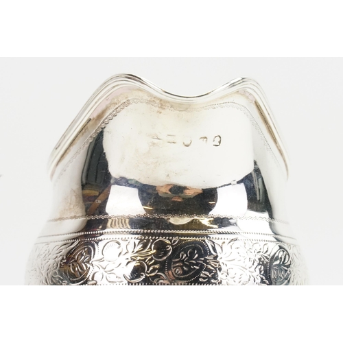 46 - A 1803 Georgian floral decorated and engraved cream jug. Weight 114g.