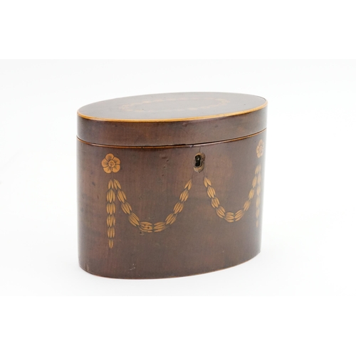 578 - A Georgian inlaid tea caddy in an oval design. 15cm wide by 12.5cm high.