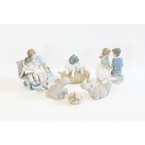 368D - A Pair of Nao Rhino's along with a Lladro Basket of Flowers. (AF), along with a Lladro Figurine of a... 