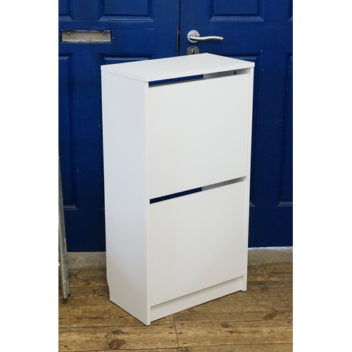 516 - A White Ikea Shoe Storage Cupboard. Measuring: 49cms across x 28cms deep x 93cms high.