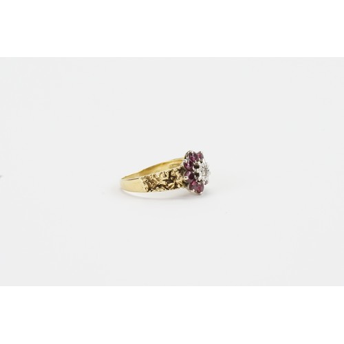 110 - A 18ct gold diamond & ruby cluster ring. Set with 8 small rubies. Size P. Weight 5.4g