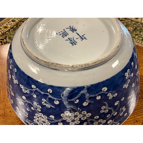 390 - A Chinese blue and white floral decorated large bowl, possibly marked with the four character mark o... 