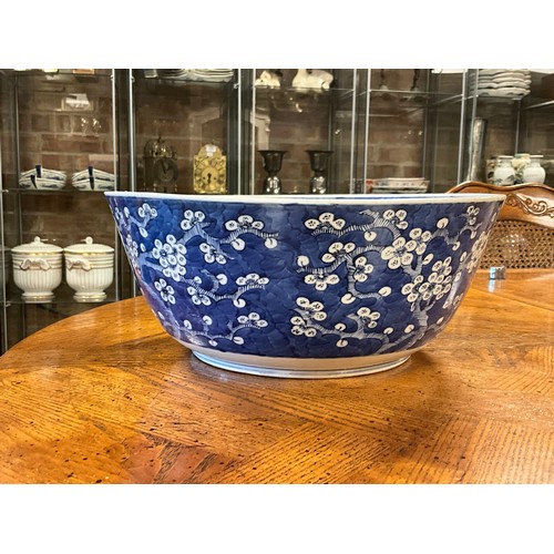 390 - A Chinese blue and white floral decorated large bowl, possibly marked with the four character mark o... 