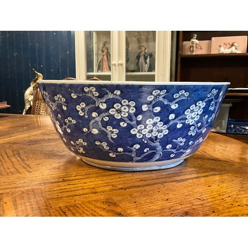 390 - A Chinese blue and white floral decorated large bowl, possibly marked with the four character mark o... 