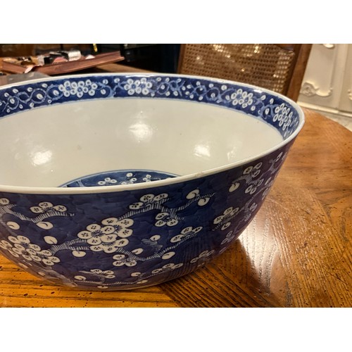 390 - A Chinese blue and white floral decorated large bowl, possibly marked with the four character mark o... 