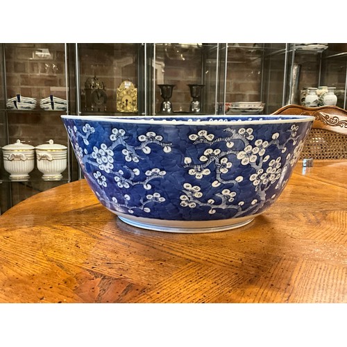 390 - A Chinese blue and white floral decorated large bowl, possibly marked with the four character mark o... 