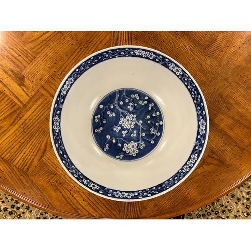 390 - A Chinese blue and white floral decorated large bowl, possibly marked with the four character mark o... 