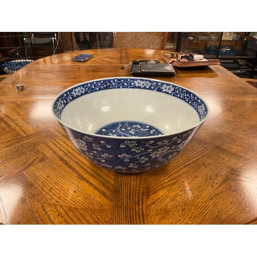 390 - A Chinese blue and white floral decorated large bowl, possibly marked with the four character mark o... 