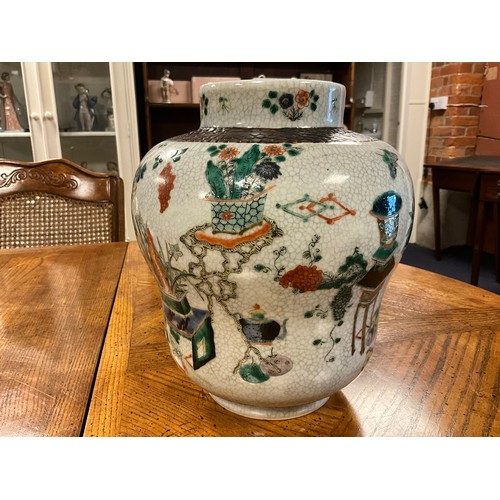 393 - A Japanese Crackle Glazed Green, Rust & Blue Garden Scene Jar & Cover. Measuring: 32cms High.