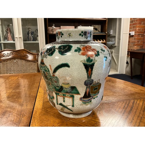 393 - A Japanese Crackle Glazed Green, Rust & Blue Garden Scene Jar & Cover. Measuring: 32cms High.