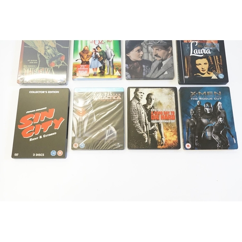 577 - A collection of DVDs to include steel back, sealed DVDs, to include X-men, die hard, battle star gal... 