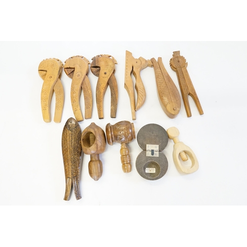 851 - A Collection of Modern Friesian Chip Carved Nut Crackers, Screw Thread & Fish Shape. (11 in Total).