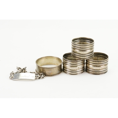 89 - Three Silver Napkin Rings along with an ID Bracelet.