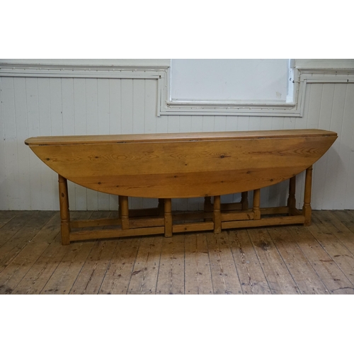 688 - An Irish Pine Wake Table with Fold-Out Bulbous Flaps & Square Cross Stretchers in the Irish Taste. M... 