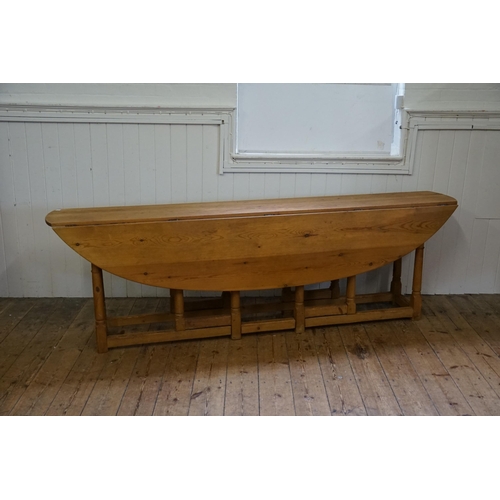 688 - An Irish Pine Wake Table with Fold-Out Bulbous Flaps & Square Cross Stretchers in the Irish Taste. M... 