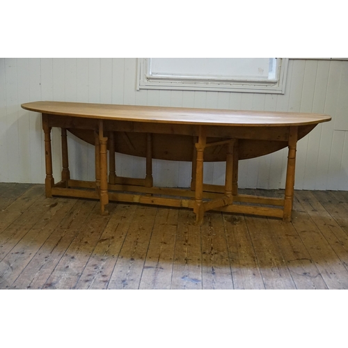 688 - An Irish Pine Wake Table with Fold-Out Bulbous Flaps & Square Cross Stretchers in the Irish Taste. M... 