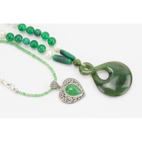 339 - A malachite and green stone necklace, along another green stone necklace and a ring.