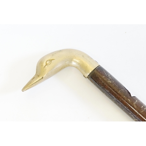 828 - A Brass Headed Swan Walking Stick.