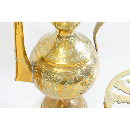 954 - A Turkish Brass Coffee Pot, a Shell Case & a Lion Trivet Stand, etc.