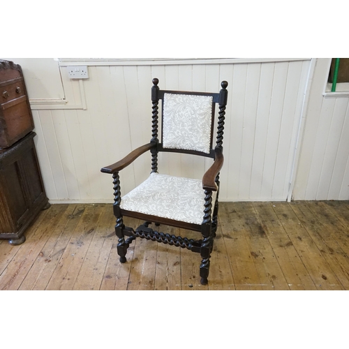 621 - An Edwardian Barley Twist Elbow Chair with a padded Seat & Back upholstered in Floral Needlework.