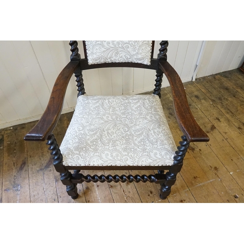 621 - An Edwardian Barley Twist Elbow Chair with a padded Seat & Back upholstered in Floral Needlework.