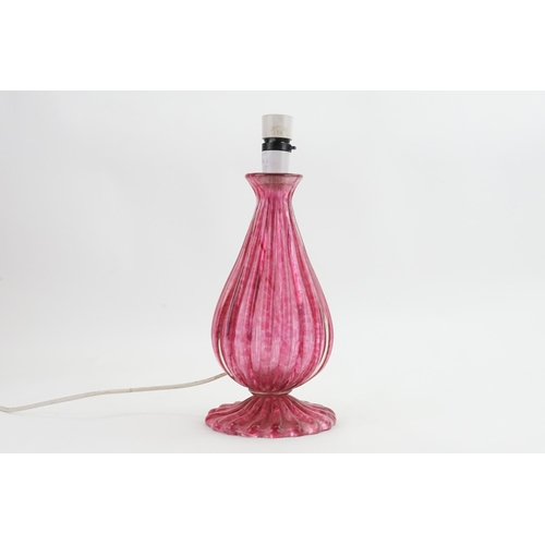 807 - A Pink Murano Glass Table Lamp of Fluted Shape fitted for electricity.