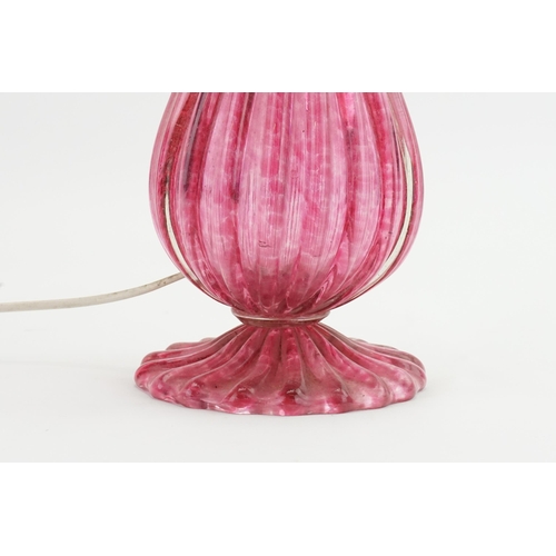 807 - A Pink Murano Glass Table Lamp of Fluted Shape fitted for electricity.