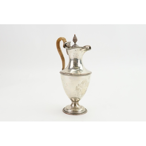 112 - An Adams design Sheffield Silver Plated Hot Water Jug with a Pineapple Finial & a Cane Handle.