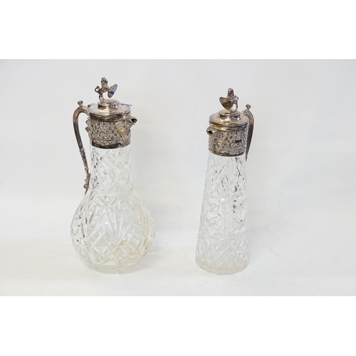 114 - Two modern Silver Plated Claret Jugs with Cut Glass bases & Lions surmounts.