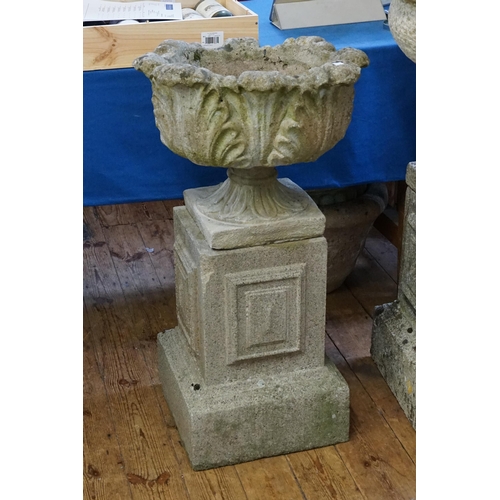 933 - A Classical design Gadrooned & Scroll Pedestal Garden Urn resting on a square base. Measuring: 87cms... 