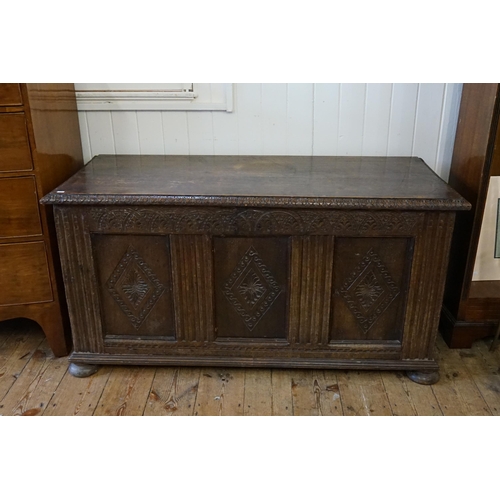 635 - A Victorian Three Panelled Oak Coffer with Gadrooned & Chip Carving resting on Bun Feet. Measuring: ... 