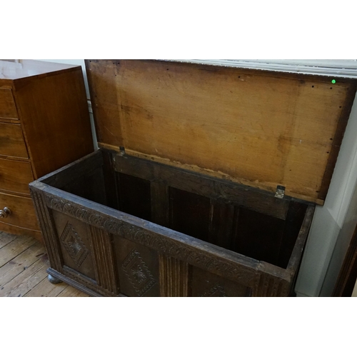 635 - A Victorian Three Panelled Oak Coffer with Gadrooned & Chip Carving resting on Bun Feet. Measuring: ... 