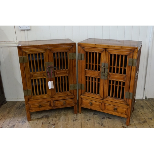 637 - A Pair of Chinese Hardwood Open Doored Food Storage Cabinets. Measuring: 69cms across x 38cms deep x... 