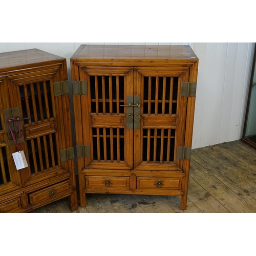 637 - A Pair of Chinese Hardwood Open Doored Food Storage Cabinets. Measuring: 69cms across x 38cms deep x... 