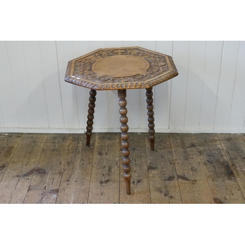 639 - A Chestnut Arts & Crafts Gypsy Table resting on three turned legs & an Hexagonal Top. Measuring: 58c... 